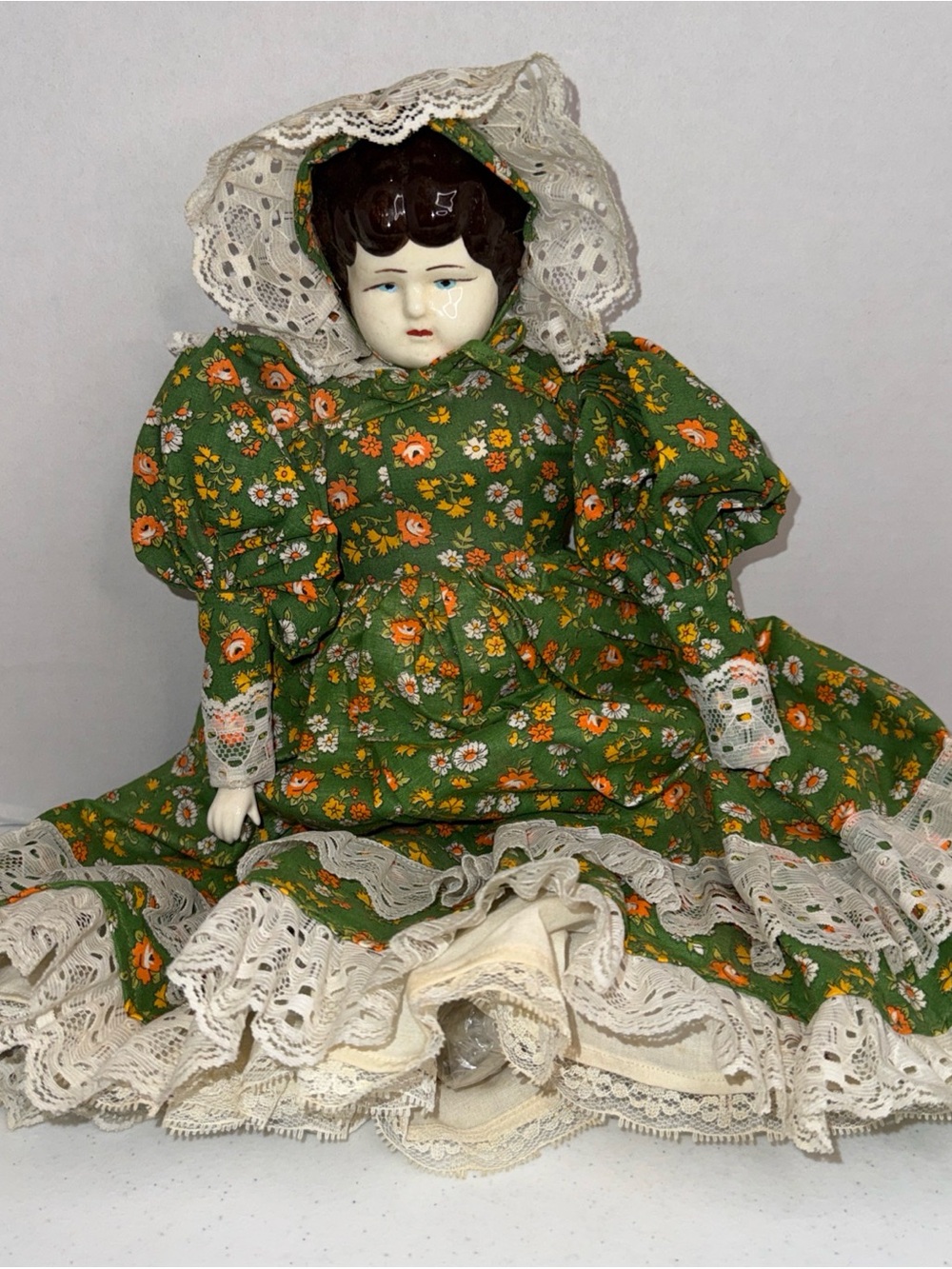 Vintage German made Doll in Green Floral Dress with porcelain head, hands, feet